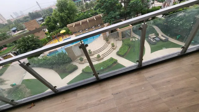 Balcony view of landscaped green parks and amenities at DLF The Pinnacle Sector 43.- The Soni Landbase